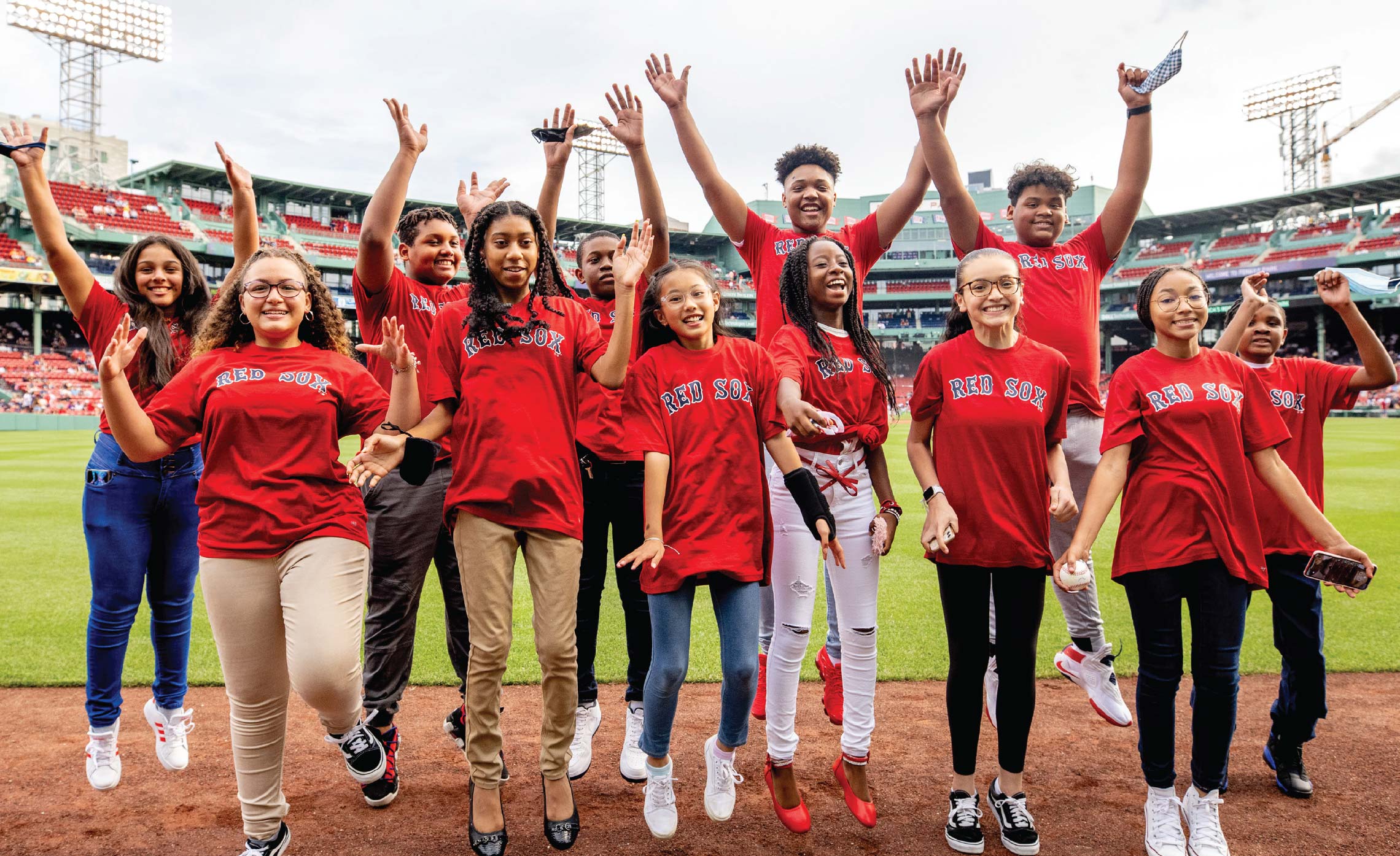 Red Sox Foundation kids jumping at Fenway Park