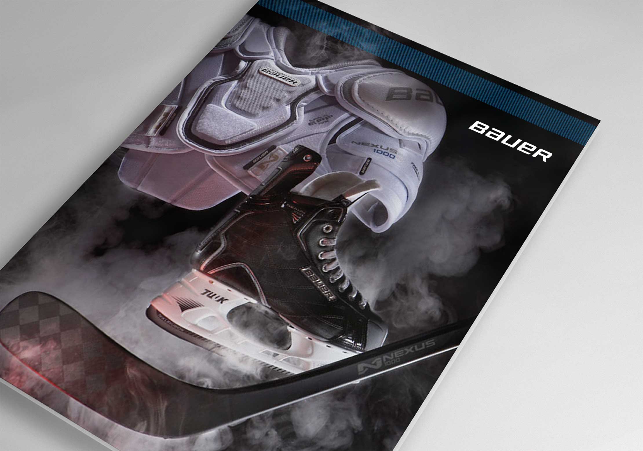 cover of a bauer hockey product catalog showing creative photography of products using dry ice smoke