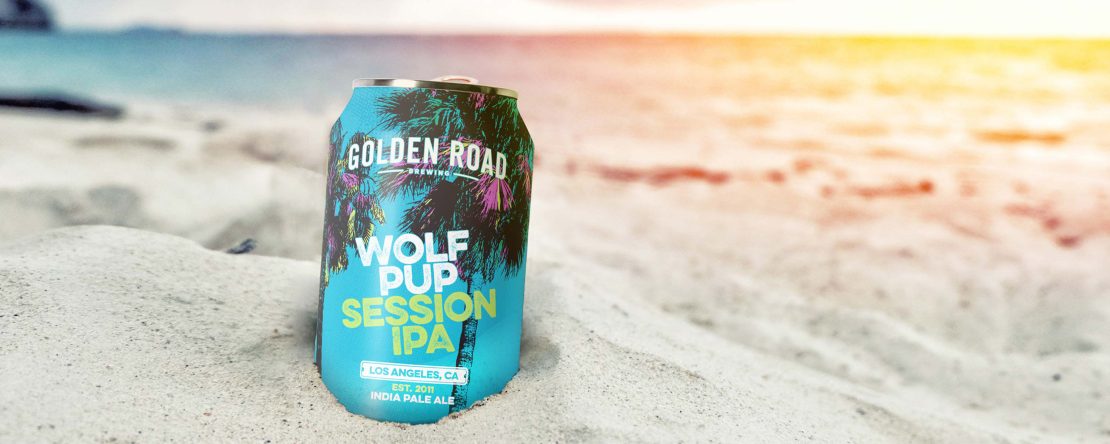 packaging design and Illustration: Golden Road Wolf Pup Session IPA can sitting in sand on the beach