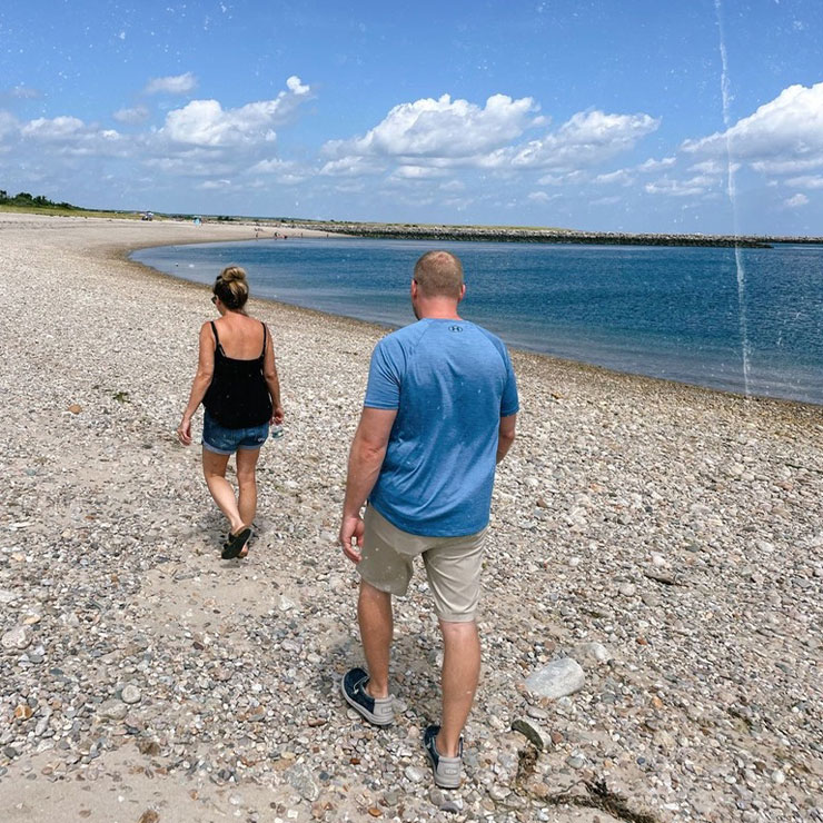 Sydney's parents walking on the beach