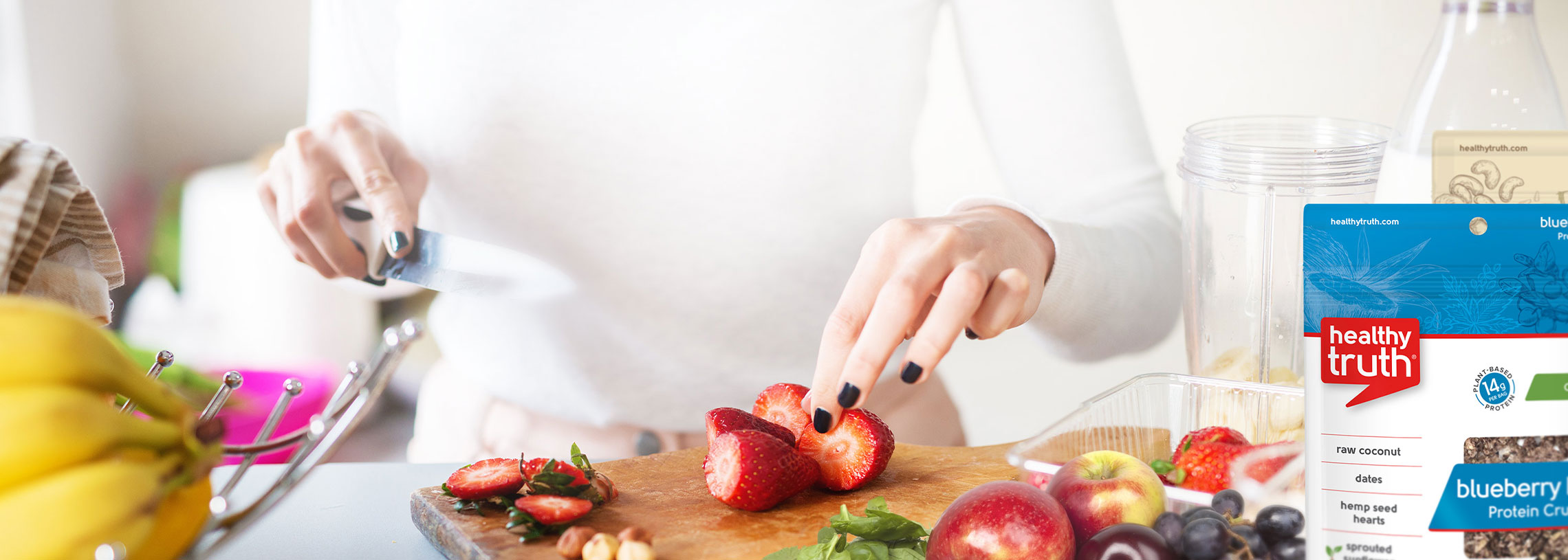 person cutting strawberries