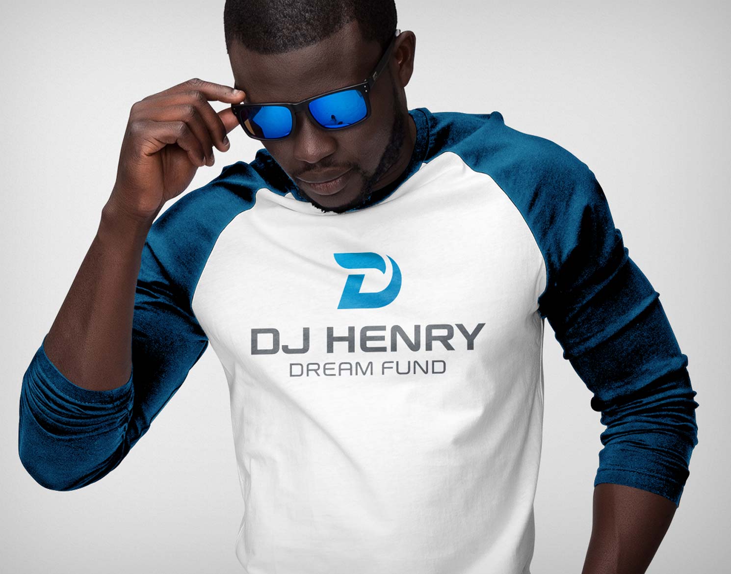 Man wearing sunglasses and baseball tee with DJ Henry Dream Fund logo