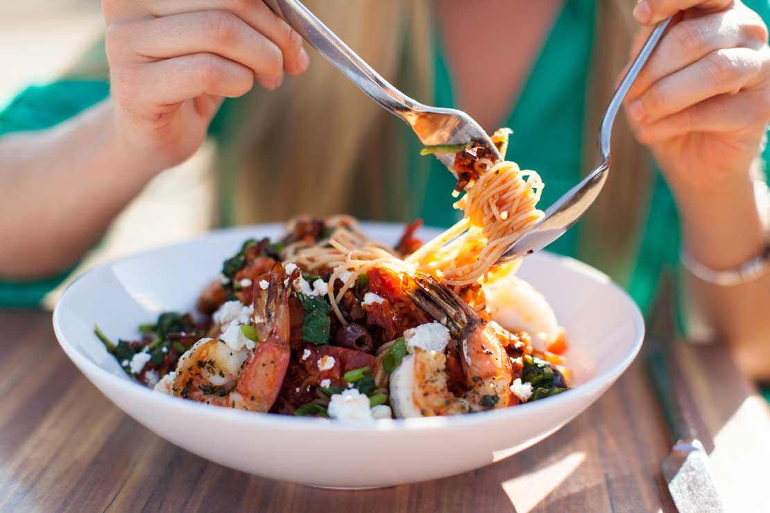 shrimp pasta in white dish