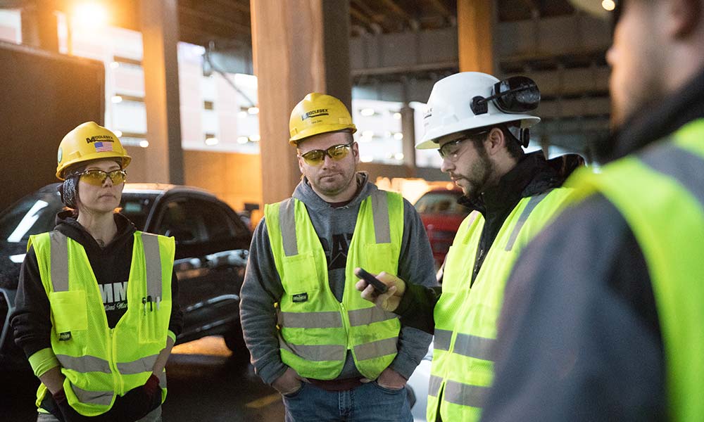 photography of worksite and employess in hard hats