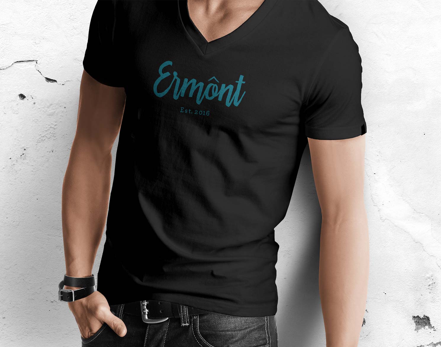 man wearing a black v-neck t-shirt with Ermont logo on front