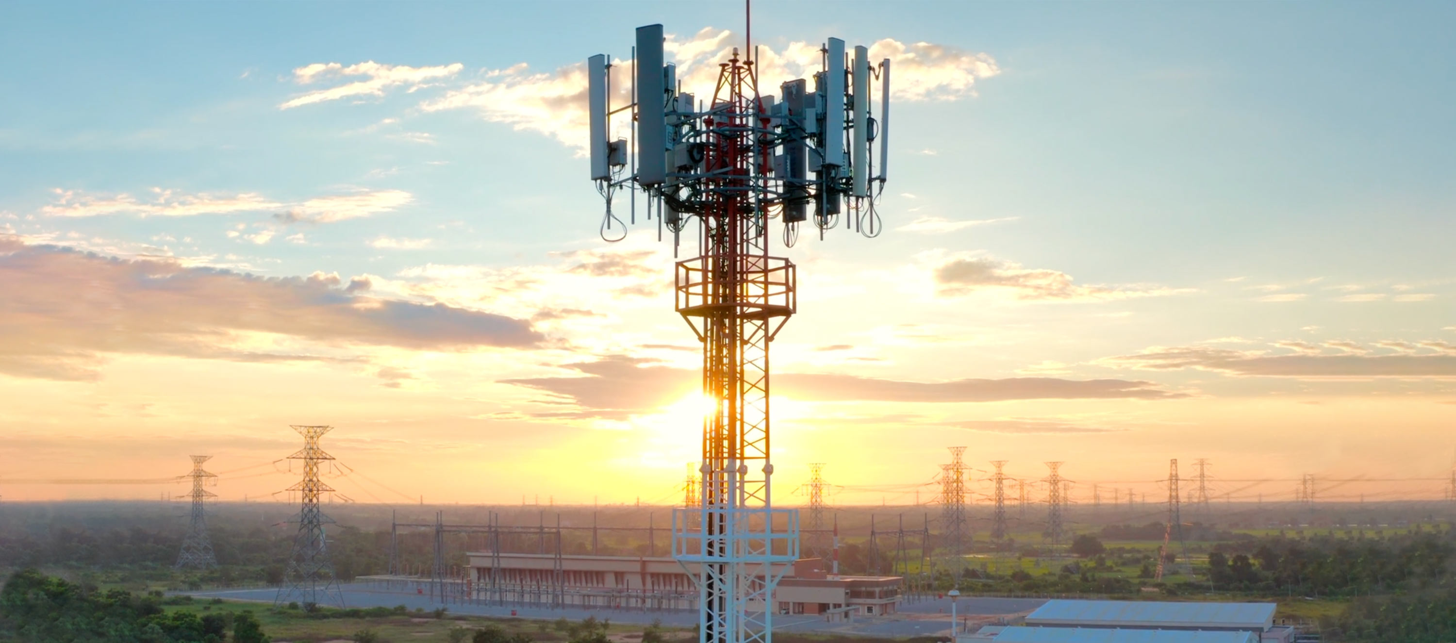 Aerial view of telecommunications cellular tower at sunset