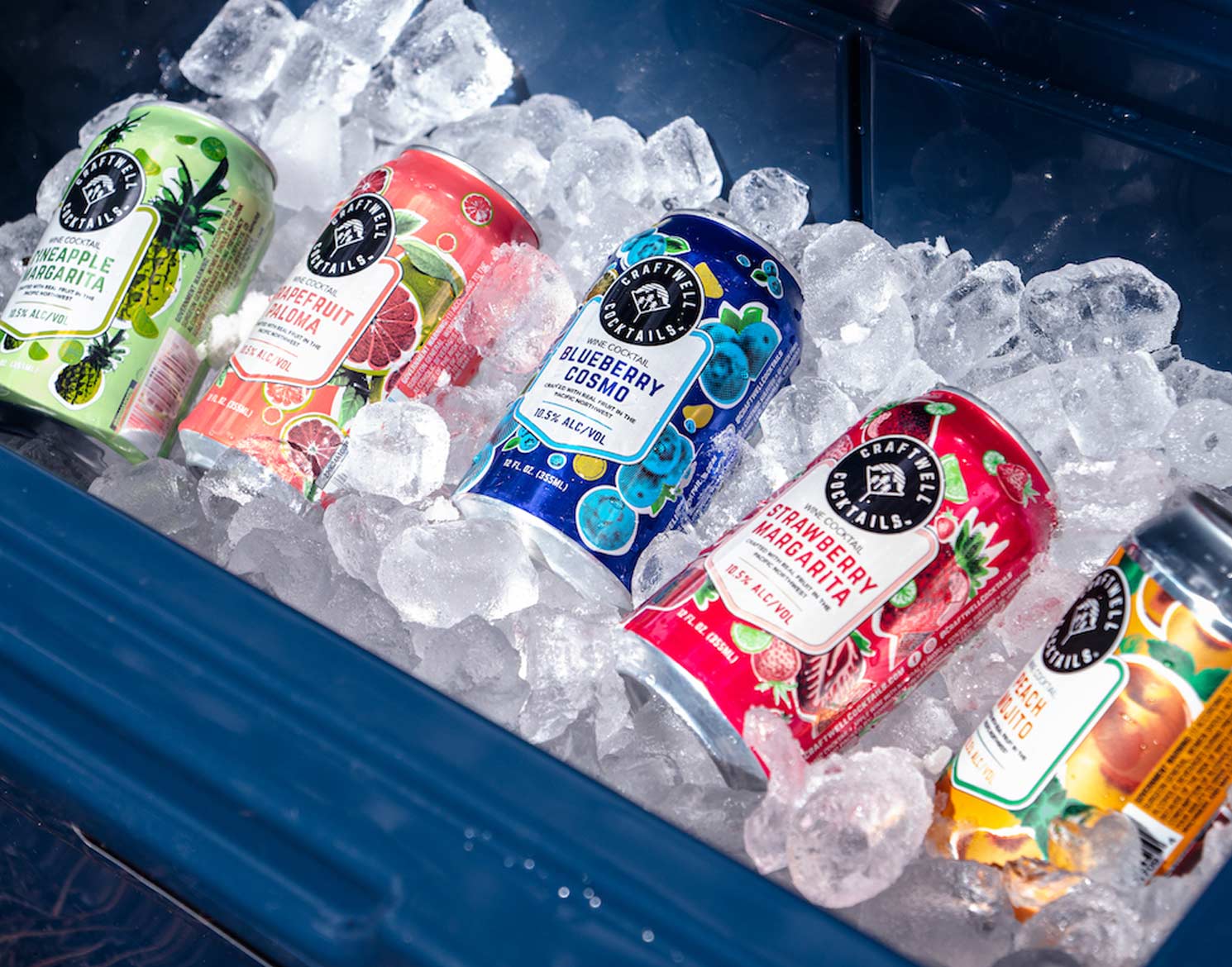 5 different flavored Craftwell Cocktail cans on top of a bed of ice